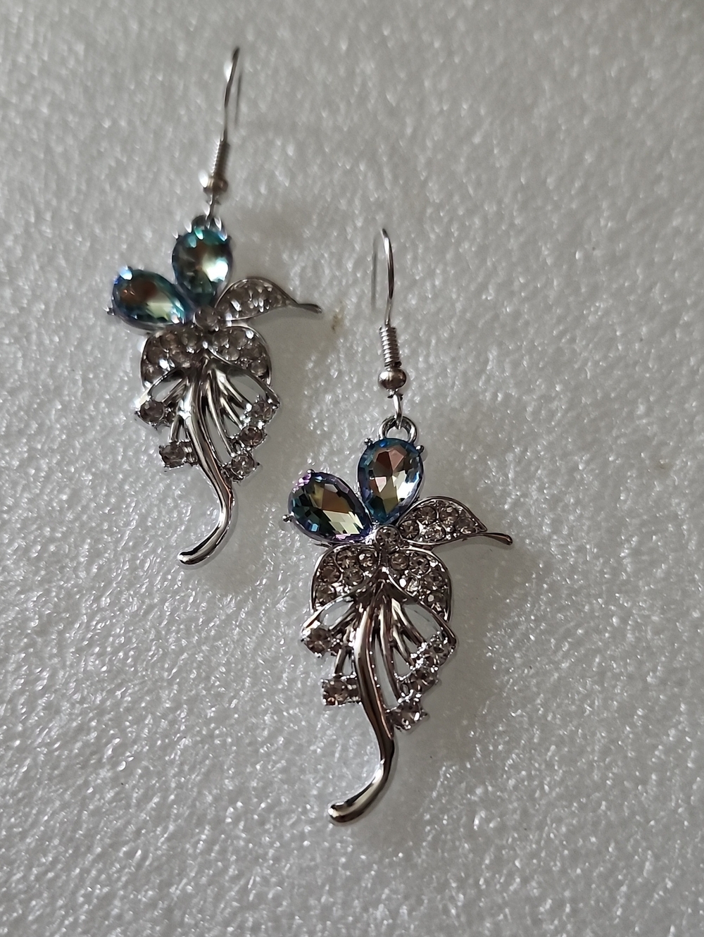 Hand Crafted Silver Floral Drop Earrings with Blue-Green Crystal Accents